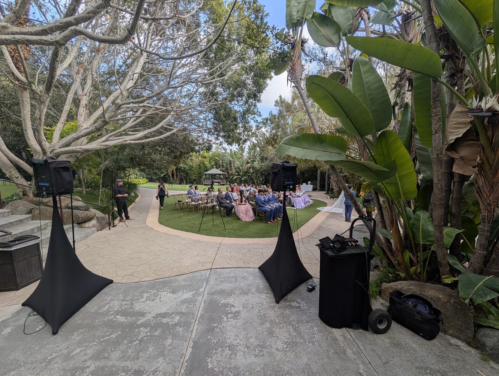 Garden wedding ceremony with Paul's sound system set up at Botanica in Oceanside