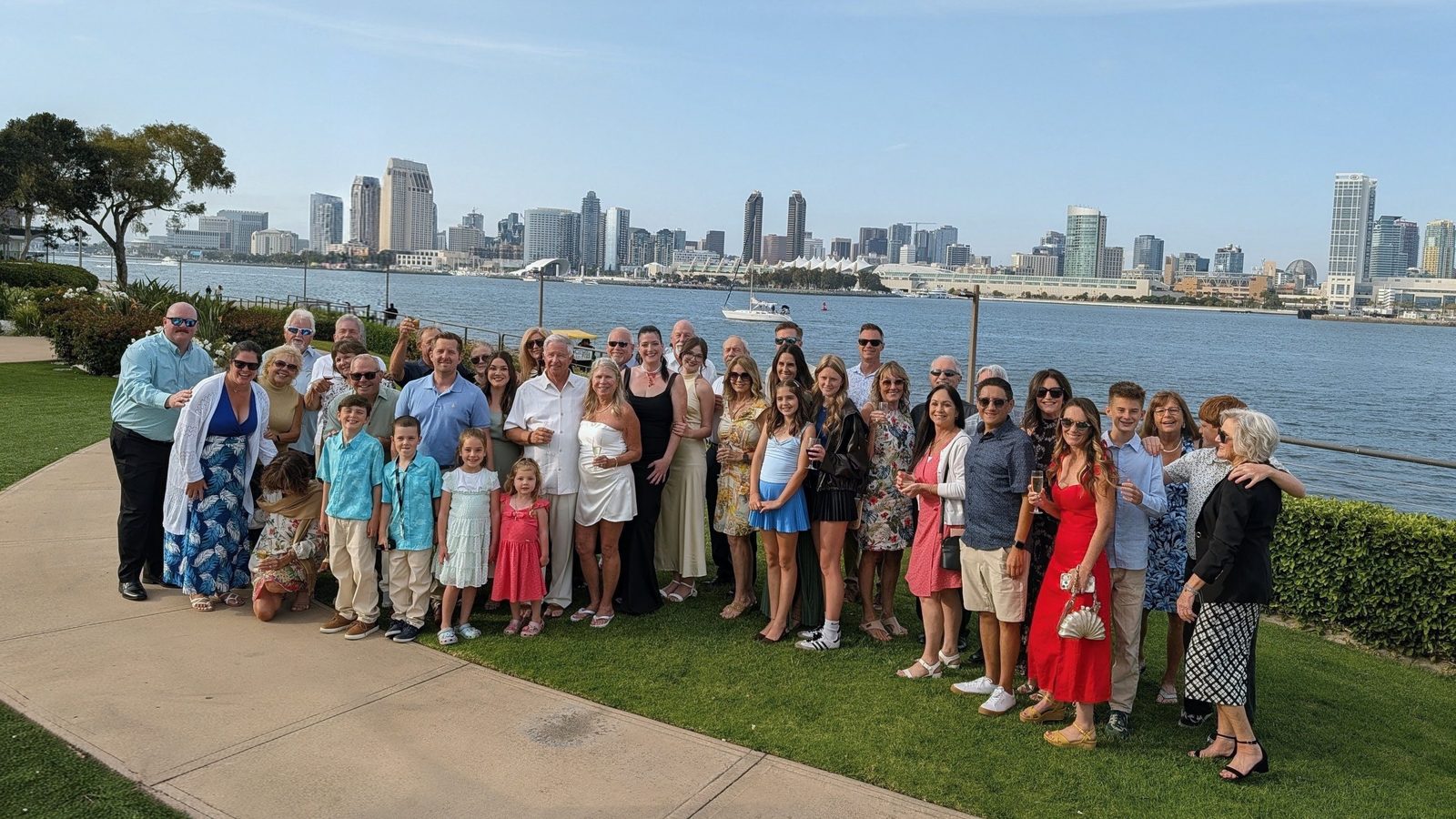 Large family and friends group photo with the San Diego bay and skyline behind them