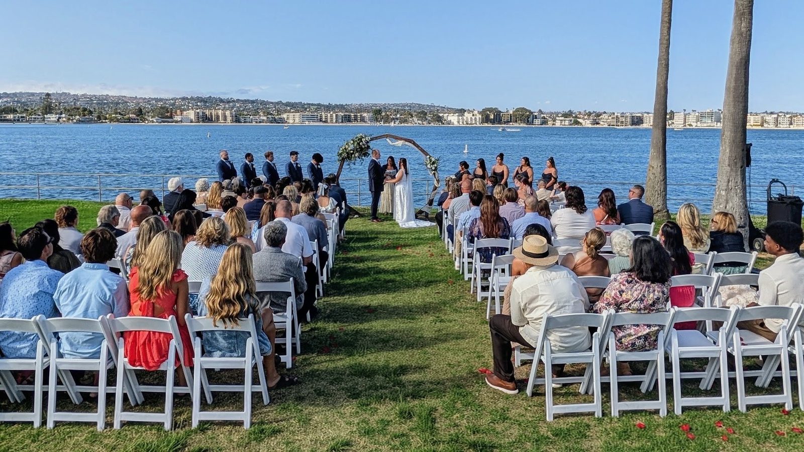 Waterfront wedding ceremony on the bay at the Tower Beach Club in Mission Beach
